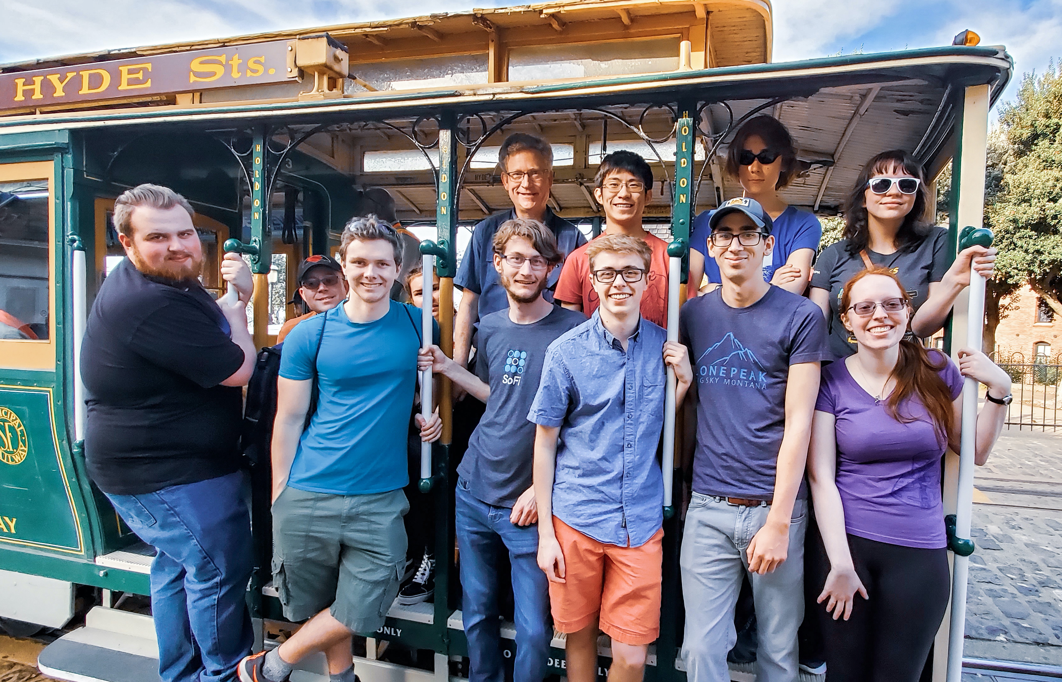 Group of people riding a cable car.